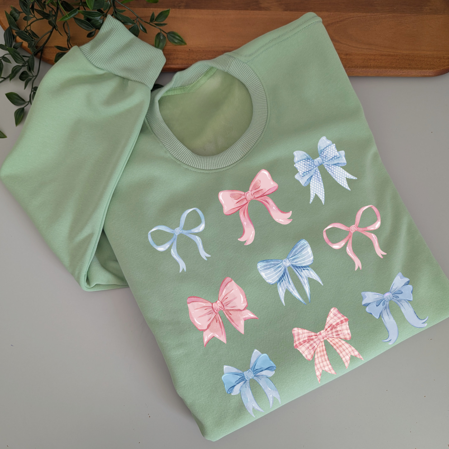 Pastel watercolour bows cute fleece women's jumper. Soft fleece want jumper. Denim Blue or cream jumper. Girly bows.