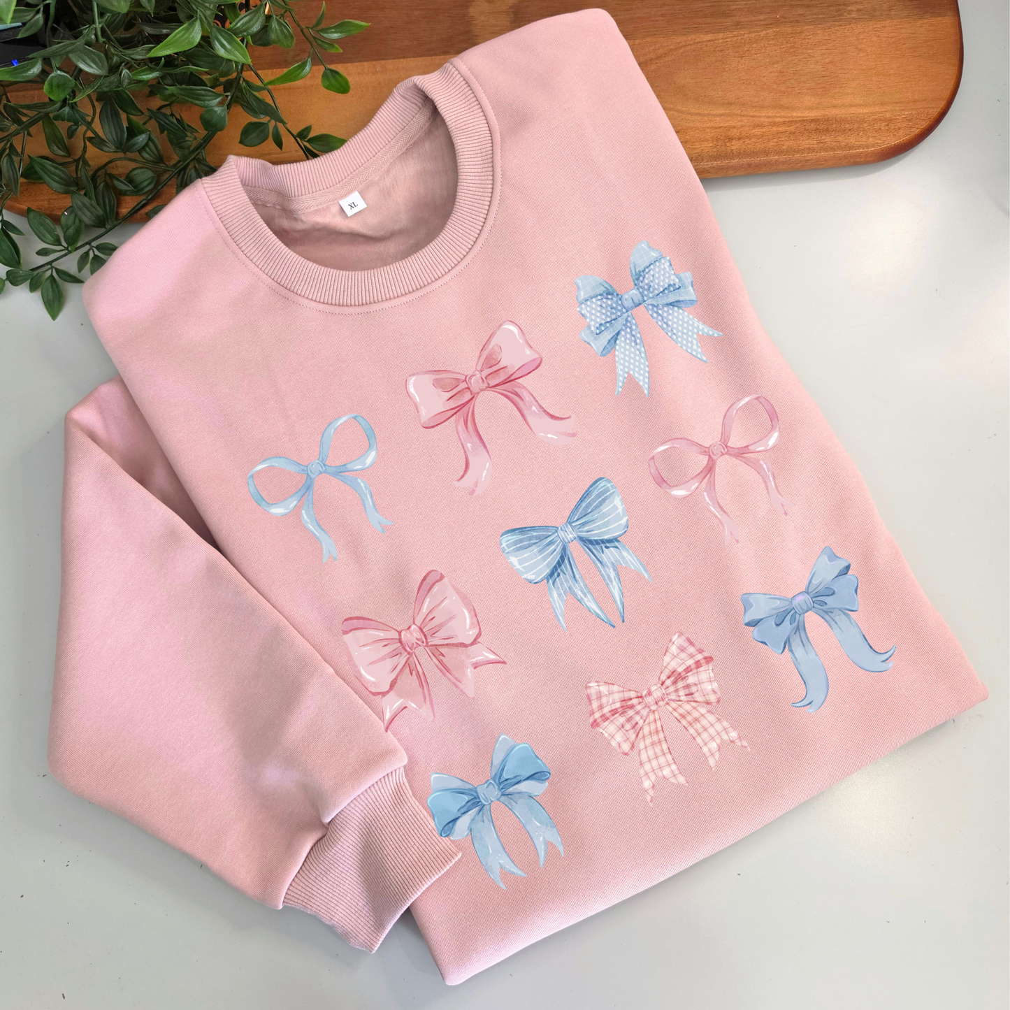 Pastel watercolour bows cute fleece women's jumper. Soft fleece want jumper. Denim Blue or cream jumper. Girly bows.